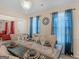 Elegant dining room with chandelier and set table, perfect for entertaining guests in style at 141 Whistle Way, Locust Grove, GA 30248