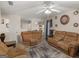 Comfortable living room with spacious seating, ceiling fan, and neutral tones, perfect for Gathering gatherings at 141 Whistle Way, Locust Grove, GA 30248