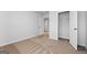 Bedroom featuring neutral walls, plush carpeting, and an open closet at 4856 Station Ln # 21, Union City, GA 30349