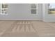 Spacious bedroom with plush carpeting and natural light from the windows at 4856 Station Ln # 21, Union City, GA 30349