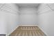 Walk-in closet with neutral walls, carpet, and shelving at 4856 Station Ln # 21, Union City, GA 30349