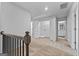 Second floor hallway featuring carpeted floors, closet, and a view of the en suite bathroom at 4856 Station Ln # 21, Union City, GA 30349