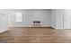 Light-filled living room featuring modern wood look flooring and a sleek electric fireplace at 4856 Station Ln # 21, Union City, GA 30349