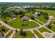 An aerial view of a neighborhood showcasing well-maintained homes and green landscaping at 550 Wentworth Ct, Fayetteville, GA 30215