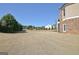 A spacious manicured backyard with neatly trimmed bushes and trees bordering the property line at 550 Wentworth Ct, Fayetteville, GA 30215