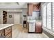 Basement bar area with wine rack, storage, mini-fridge, and countertop space at 550 Wentworth Ct, Fayetteville, GA 30215