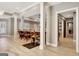 Large open basement with bar and seating and views to other entertaining areas at 550 Wentworth Ct, Fayetteville, GA 30215
