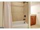 Bathroom showing a tub with a tile surround, and a shower head at 550 Wentworth Ct, Fayetteville, GA 30215