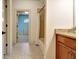 Bathroom showing granite vanity, tile flooring, and a view to a connecting room at 550 Wentworth Ct, Fayetteville, GA 30215