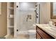 Modern bathroom with walk-in shower, white tile, and a built-in shelf at 550 Wentworth Ct, Fayetteville, GA 30215