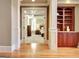 Bedroom with hardwood floors and a built in dark wood cabinet with decorative trim details at 550 Wentworth Ct, Fayetteville, GA 30215