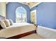 Inviting bedroom with a large arched window, vaulted ceilings, and built-in shelving at 550 Wentworth Ct, Fayetteville, GA 30215