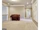 Carpeted bonus room with a classic piano, neutral walls, and bright recessed lighting at 550 Wentworth Ct, Fayetteville, GA 30215