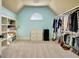 Large walk-in closet featuring blue walls, built-in shelving, and hanging racks at 550 Wentworth Ct, Fayetteville, GA 30215
