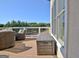 Deck features comfortable seating, outdoor storage and views of the backyard and golf course at 550 Wentworth Ct, Fayetteville, GA 30215