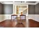 View of the dining room table and chairs with a stairway visible in the background at 550 Wentworth Ct, Fayetteville, GA 30215