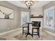 Dining room featuring a black table, two chairs and view of the fireplace at 550 Wentworth Ct, Fayetteville, GA 30215