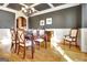 Dining room showcases a chandelier, dark accent wall, and traditional furniture setting at 550 Wentworth Ct, Fayetteville, GA 30215