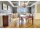 Elegant dining room featuring a coffered ceiling and chandelier lighting at 550 Wentworth Ct, Fayetteville, GA 30215