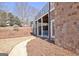 Home with a covered patio, upper-level balcony, and a well-maintained landscaped yard at 550 Wentworth Ct, Fayetteville, GA 30215