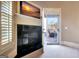 Fireplace sitting area with a door to a back porch with a view at 550 Wentworth Ct, Fayetteville, GA 30215