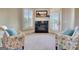 Sitting area fireplace with a flatscreen tv hanging above a fireplace at 550 Wentworth Ct, Fayetteville, GA 30215