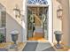 Inviting home entrance with double doors, decorative wreaths, and stylish exterior lighting at 550 Wentworth Ct, Fayetteville, GA 30215