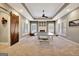 Spacious carpeted game room featuring a ping pong table, stylish ceiling fan, and attractive fireplace at 550 Wentworth Ct, Fayetteville, GA 30215