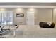 Carpeted game room with a ping pong table, bean bag chair, and white door at 550 Wentworth Ct, Fayetteville, GA 30215