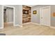 Hallway leads to game room with unique wood accent wall and a dartboard at 550 Wentworth Ct, Fayetteville, GA 30215