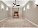 A basketball arcade game sits in an empty game room illuminated by sconces and recessed lights at 550 Wentworth Ct, Fayetteville, GA 30215