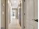 A hallway featuring wood-look floors, recessed lighting, and rustic sliding barn doors at 550 Wentworth Ct, Fayetteville, GA 30215