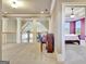Open hallway features a piano and a view into a bedroom with a ceiling fan at 550 Wentworth Ct, Fayetteville, GA 30215