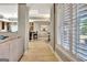 Open hallway featuring hardwood floors, white trim, and view of the living room at 550 Wentworth Ct, Fayetteville, GA 30215