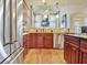 Spacious kitchen features stainless steel appliances, wooden cabinets, and a stylish tiled backsplash at 550 Wentworth Ct, Fayetteville, GA 30215