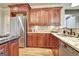 Well-appointed kitchen features granite countertops, stainless appliances, and custom wood cabinetry at 550 Wentworth Ct, Fayetteville, GA 30215