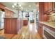Gourmet kitchen flows into living area; has wooden cabinets, stainless appliances, and center island at 550 Wentworth Ct, Fayetteville, GA 30215
