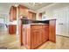 Gourmet kitchen island features gas cooktop, granite countertop, and custom cabinetry at 550 Wentworth Ct, Fayetteville, GA 30215