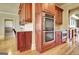 Charming kitchen with stainless steel appliances, wooden cabinets, and views to other rooms at 550 Wentworth Ct, Fayetteville, GA 30215