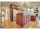 Spacious kitchen showcasing stainless steel appliances, wood cabinetry, and center island at 550 Wentworth Ct, Fayetteville, GA 30215
