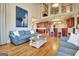 Open-concept living room featuring wood floors, comfortable seating, and views of the kitchen at 550 Wentworth Ct, Fayetteville, GA 30215
