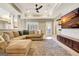 Open living room featuring a sectional sofa, media cabinet and a door to the exterior at 550 Wentworth Ct, Fayetteville, GA 30215