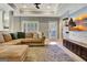 Comfortable living room with a sectional sofa, media cabinet, and access to the exterior at 550 Wentworth Ct, Fayetteville, GA 30215
