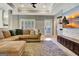 Comfortable living room with a large sectional sofa, media cabinet, and access to the exterior at 550 Wentworth Ct, Fayetteville, GA 30215
