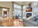 Inviting living room with vaulted ceilings, fireplace, large windows, and comfortable seating at 550 Wentworth Ct, Fayetteville, GA 30215