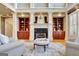 Inviting living room with a fireplace flanked by custom built-ins at 550 Wentworth Ct, Fayetteville, GA 30215