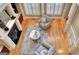 A modern living room with hardwood floors, shutters, fireplace, and stylish decor, viewed from above at 550 Wentworth Ct, Fayetteville, GA 30215
