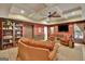 Finished basement with coffered ceilings, a cozy seating area, and bookshelves at 135 Hayden Ct, Fayetteville, GA 30215