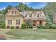 Charming home with a landscaped front yard and welcoming porch, perfect for enjoying the outdoors at 135 Hayden Ct, Fayetteville, GA 30215