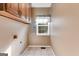 Efficient laundry room with upper cabinets and window bringing in natural light at 333/337 Old Carrollton Rd, Roopville, GA 30170